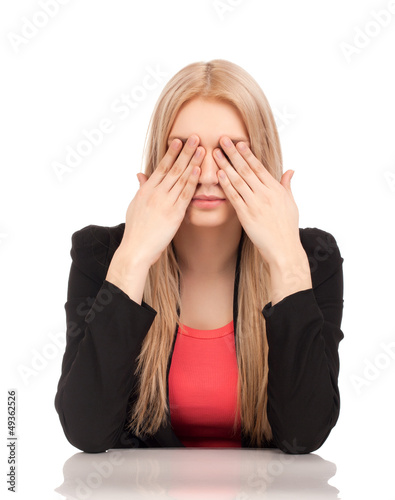 Photo: Business woman covering her eyes Business woman covering her eyes