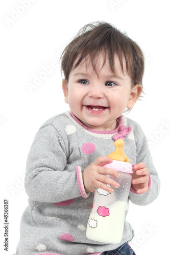 Photo: Happiness baby holding a feeding bottle Happiness baby holding a feeding bottle
