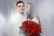 happy girl with bouquet of red roses kissing her boyfriend