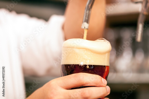 Photo: Man drawing a beer Man drawing a beer