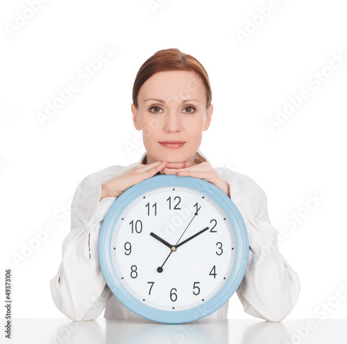 Photo: Woman with a clock against white background Woman with a clock against white background