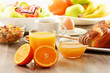 Breakfast including coffee, bread, honey, orange juice, muesli a