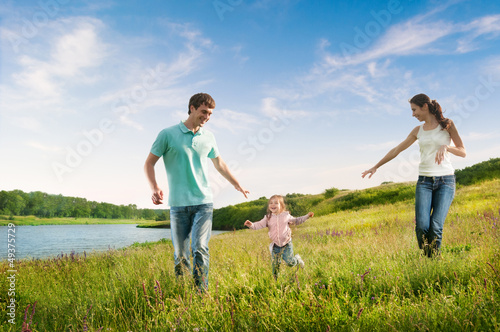Photo: happy family having fun outdoors happy family having fun outdoors