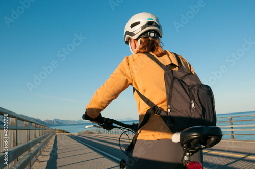 Photo: woman cycling outdoors woman cycling outdoors