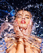 Wet woman face with water drop.