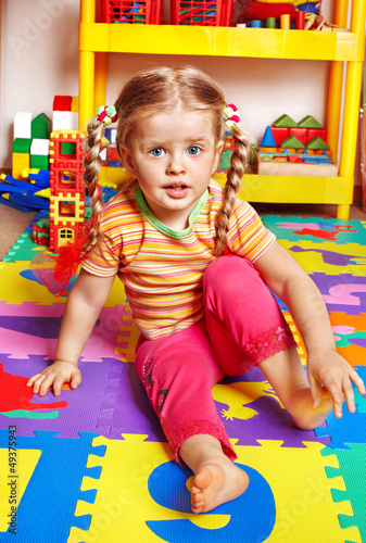 Photo: Child playing with building block . Child playing with building block .