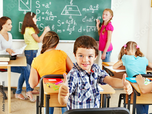 Photo: School child with teacher. School child with teacher.
