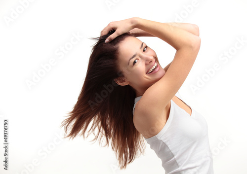 Photo: Portrait of a beautiful young woman with hair flying Portrait of a beautiful young woman with hair flying