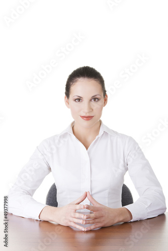 Photo: Young beautiful happy businesswoman at the desk, Young beautiful happy businesswoman at the desk,