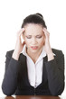 Photo: Sad businesswoman sitting behind the desk Sad businesswoman sitting behind the desk