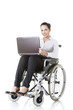 Photo: Disabled businesswoman sitting in a wheel chair Disabled businesswoman sitting in a wheel chair