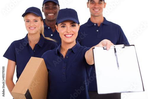 Photo: group of professional courier service staff with parcel group of professional courier service staff with parcel