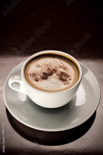 Photo: White porcelain cup od cappuccino coffee White porcelain cup od cappuccino coffee