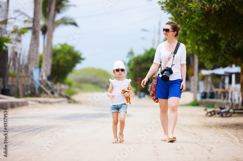 Photo: Mother and daughter walking outdoors Mother and daughter walking outdoors