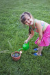 Little girl watering the plants