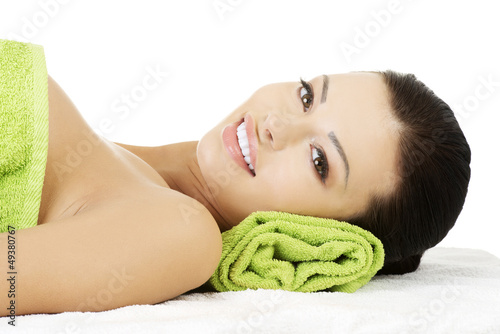 Photo: Beauty young woman relaxing in spa. Beauty young woman relaxing in spa.