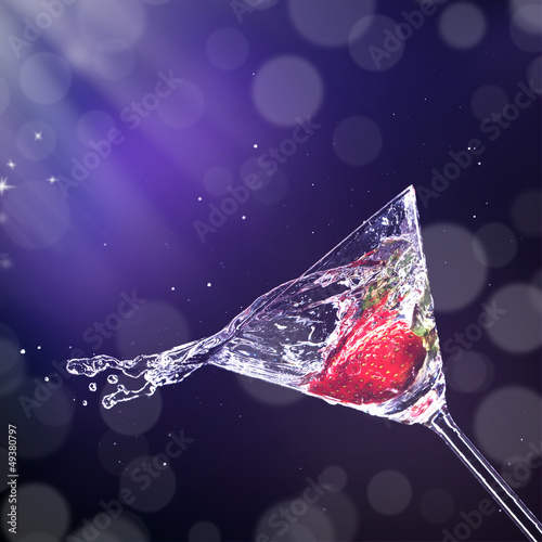 Photo: Martini drink splashing out of glass Martini drink splashing out of glass