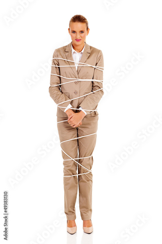 Photo: young woman tied up by rope isolated on white young woman tied up by rope isolated on white