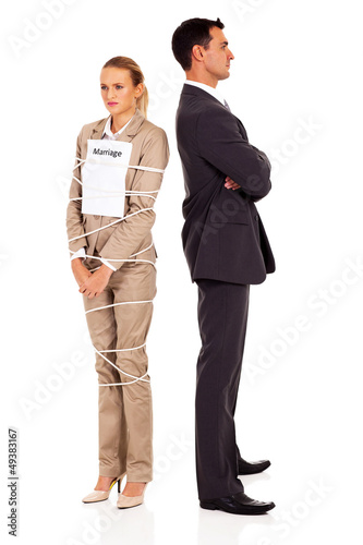 Photo: young woman tied with marriage isolated on white young woman tied with marriage isolated on white
