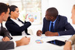 Photo: group of business people having meeting together group of business people having meeting together