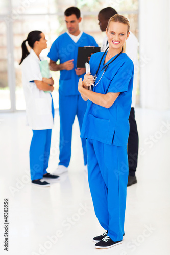 Photo: pretty young medical nurse and colleagues pretty young medical nurse and colleagues