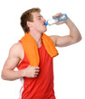 Photo: sportsman drinks water from a bottle. isolated on white sportsman drinks water from a bottle. isolated on white
