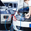 Car mechanic checking the air handling unit of a car