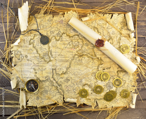 Photo: Pirate map with coins and scroll Pirate map with coins and scroll