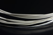 Photo: Guitar Strings Close-Up on Glossy Black Background Guitar Strings Close-Up on Glossy Black Background