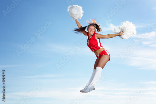 Photo: Young female cheerleader Young female cheerleader