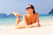 woman is lying on beach