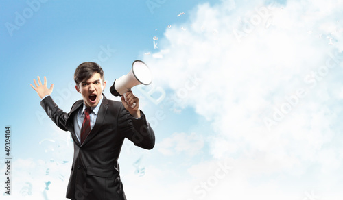 Photo: businessman with megaphone businessman with megaphone