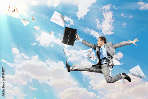 Photo: Image of jumping businessman Image of jumping businessman