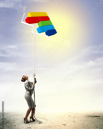 Photo: Image of businesswoman climbing the rope Image of businesswoman climbing the rope