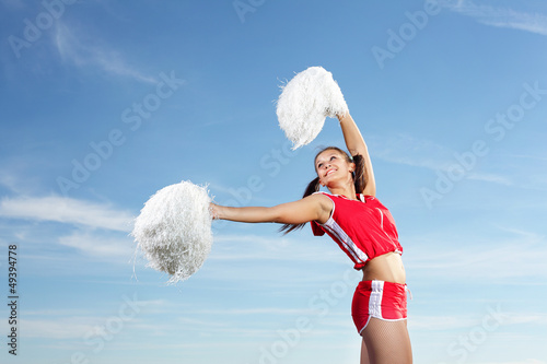 Photo: Young female cheerleader Young female cheerleader