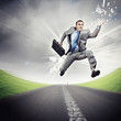 Businessman running on the road
