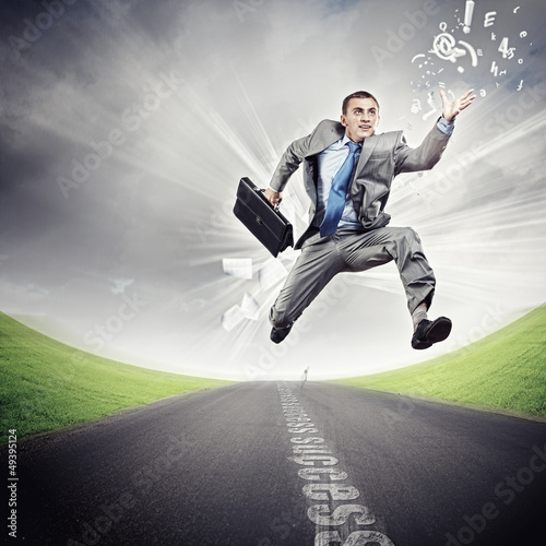 Photo: Businessman running on the road Businessman running on the road