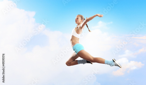 Photo: Image of sport woman jumping Image of sport woman jumping