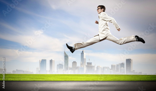 Photo: Businessman running on the road Businessman running on the road