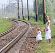 Photo: railroad and a mother with her daughter railroad and a mother with her daughter