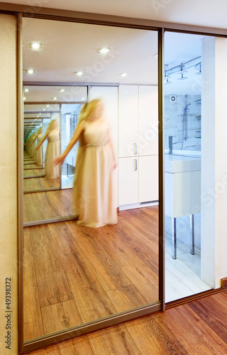 Photo: Mirror wardrobe in modern hall interior with infinity reflection Mirror wardrobe in modern hall interior with infinity reflection