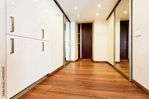 Photo: Modern minimalism style corridor interior with sliding-door mirr Modern minimalism style corridor interior with sliding-door mirr