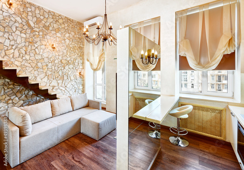 Photo: Modern style living-room interior with staircase and ashlar wall Modern style living-room interior with staircase and ashlar wall