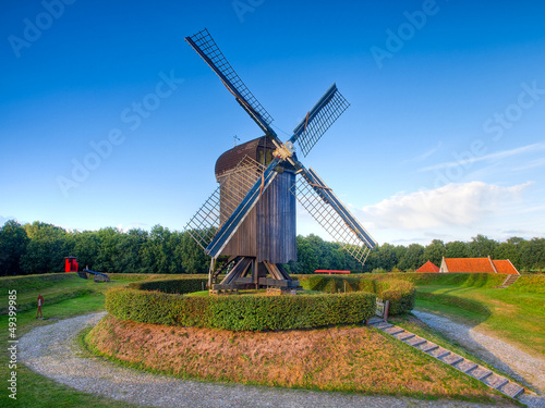 Photo: Dutch Wooden Windmill in an Old Fortified Village Dutch Wooden Windmill in an Old Fortified Village