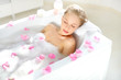 Attractive girl relaxing in bath