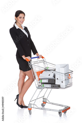 Photo: Attractive Businesswoman With Shopping Cart Attractive Businesswoman With Shopping Cart