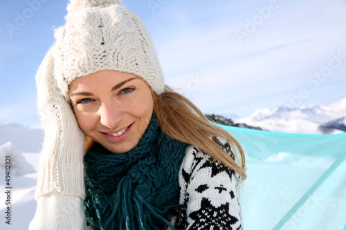 Photo: Portrait of beautiful woman in snowy mountain Portrait of beautiful woman in snowy mountain