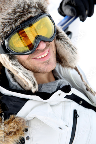 Photo: Portrait of swnowboarder standing on snow track Portrait of swnowboarder standing on snow track