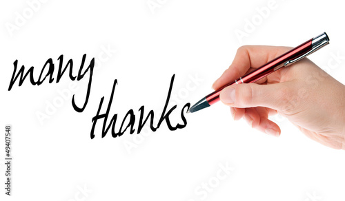 Photo: hand with pen writes many thanks hand with pen writes many thanks