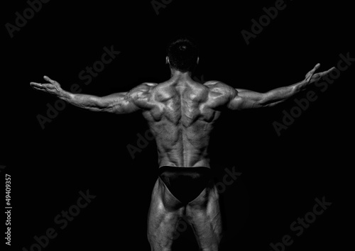 Photo: Fit male model showing his back Fit male model showing his back